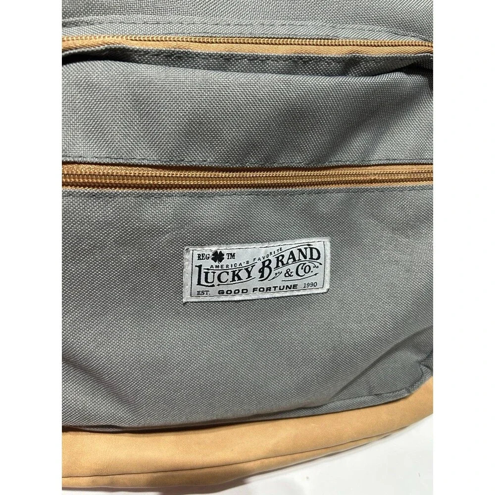 Lucky Brand Grey Canvas Backpack Tan Faux Leather Trim Clover Logo Travel Bag